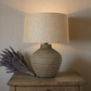 BROWN CERAMIC LAMP W/ HESSIAN SHADE